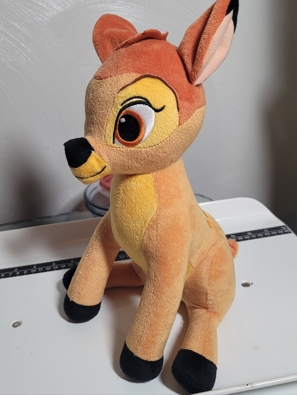 NWOT. Disney Bambi Plush in Orange and Yellow with Black Accents